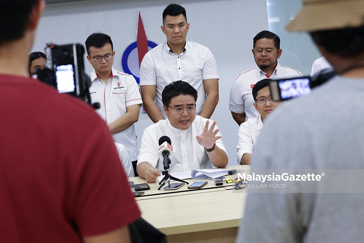 Woo Kah Leong disiasat karikatur Razman karikatur Razman Zakaria, Woo Kah Leong DAPSY, siasatan polis ADUN Pasir Bedamar, isu kebebasan bersuara Malaysia, politik sindiran DUN Perak