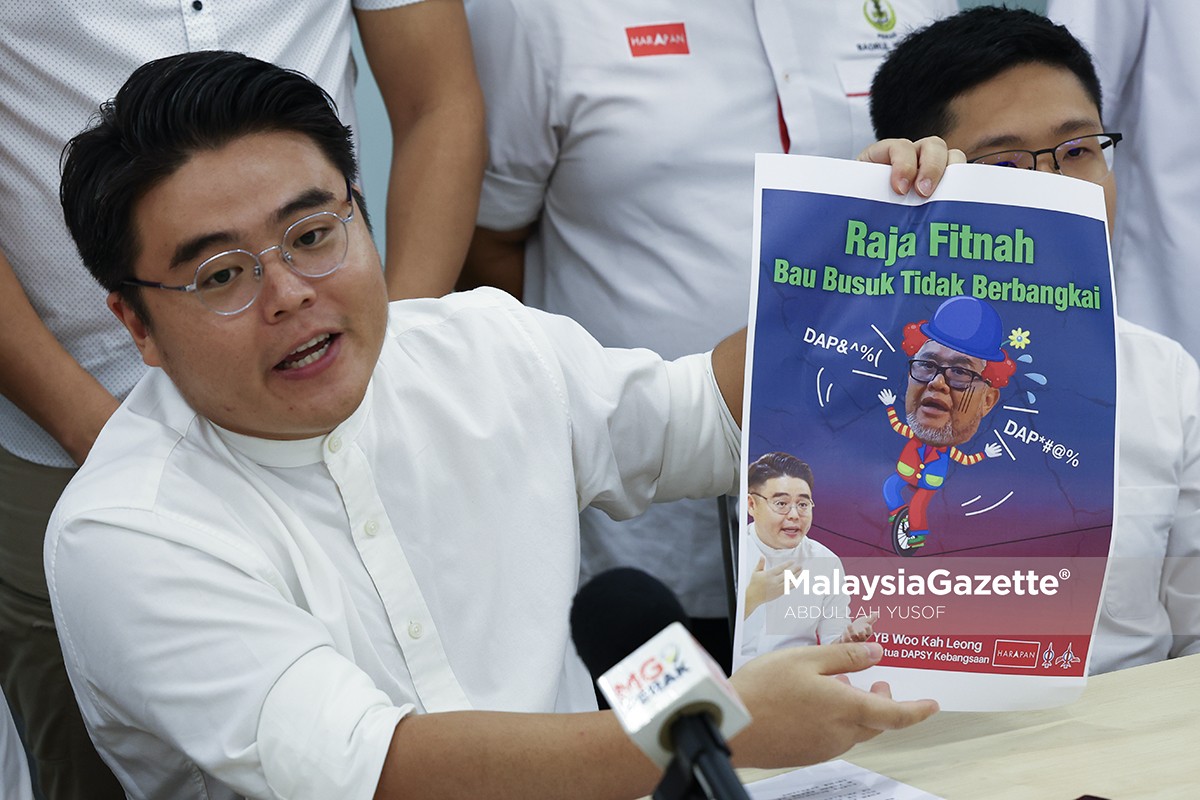 Woo Kah Leong disiasat karikatur Razman karikatur Razman Zakaria, Woo Kah Leong DAPSY, siasatan polis ADUN Pasir Bedamar, isu kebebasan bersuara Malaysia, politik sindiran DUN Perak